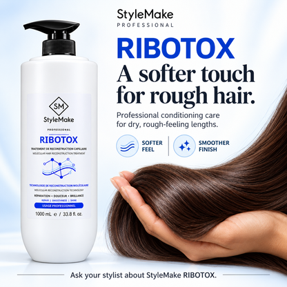A bottle of StyleMake Professional Ribotox hair repair treatment stands next to a hand holding a strand of long, smooth brown hair against a light blue background with product text. 	StyleMake RIBOTOX bottle beside brown hair resting in a hand, highlighting softer-feeling lengths and a smoother finish.